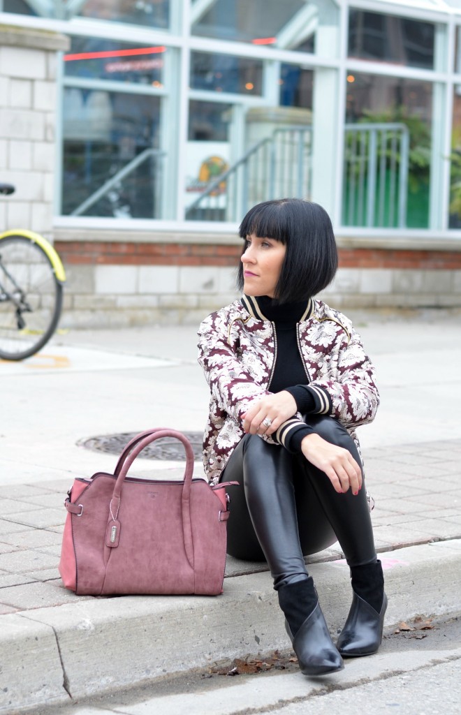 pink mohair cardigan with black leather leggings on Craiyon