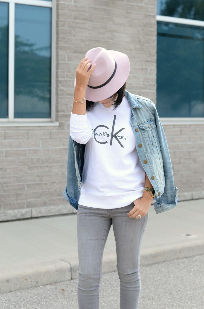 White Calvin Klein Sweater, CK Sweater, Who to wear a Logo Sweater, Toms Sunglasses, Pink Fedoa, Wittnauer Watch, Gold Watch, Denim Jacket, Gap Denim Jacket, How to style a jean jacket, how to style a denim jacket, jean jacket 