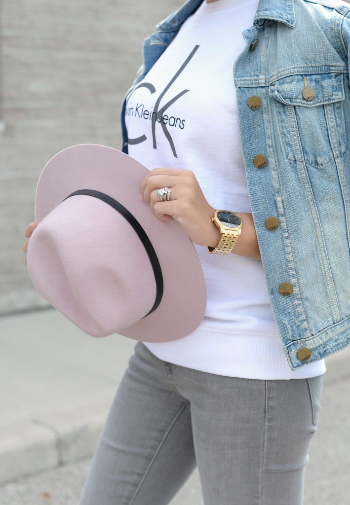 White Calvin Klein Sweater, CK Sweater, Who to wear a Logo Sweater, Toms Sunglasses, Pink Fedoa, Wittnauer Watch, Gold Watch, Denim Jacket, Gap Denim Jacket, How to style a jean jacket, how to style a denim jacket, jean jacket 