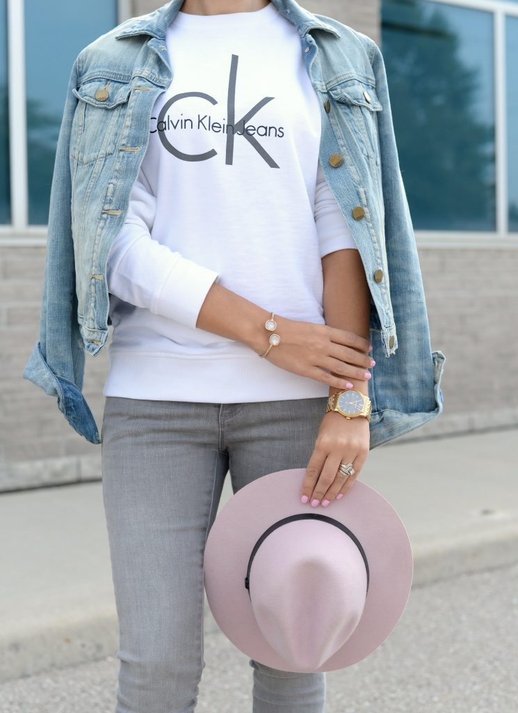 White Calvin Klein Sweater, CK Sweater, Who to wear a Logo Sweater, Toms Sunglasses, Pink Fedoa, Wittnauer Watch, Gold Watch, Denim Jacket, Gap Denim Jacket, How to style a jean jacket, how to style a denim jacket, jean jacket 