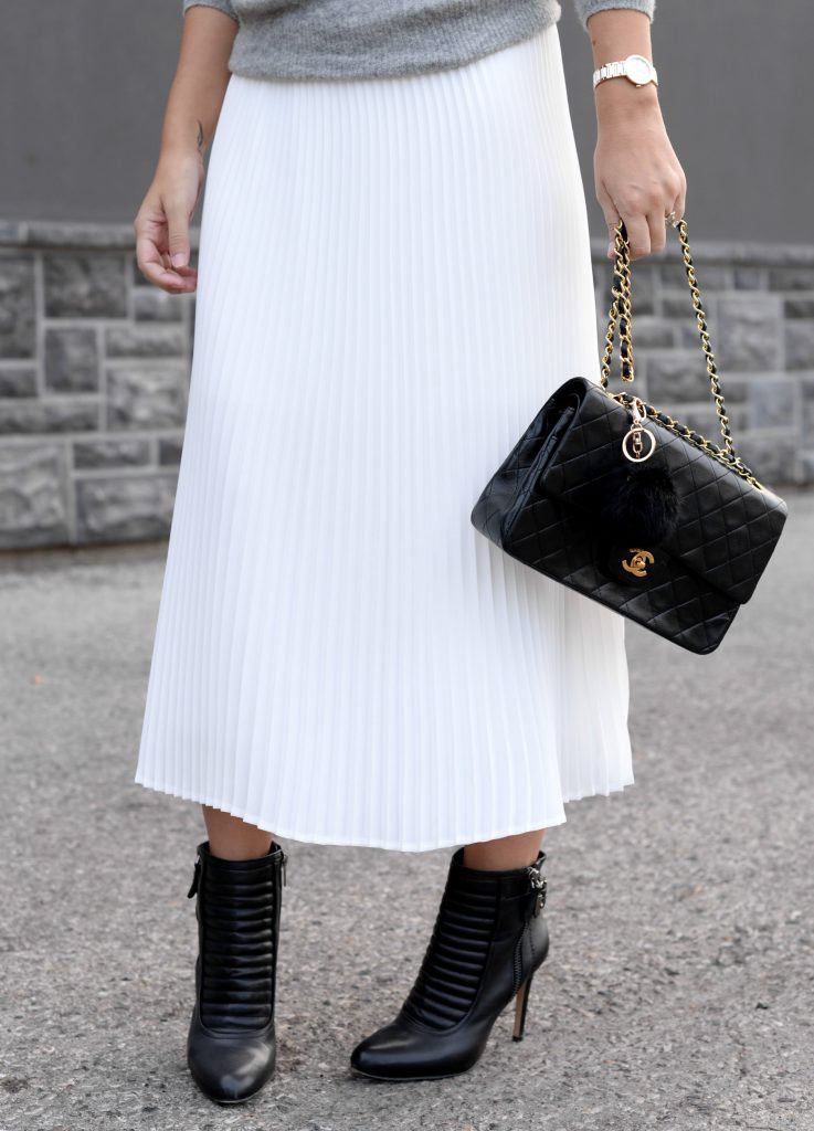 Pleats Are Back, spring skirt, what to wear this spring, grey Cashmere Sweater, Aritzia sweater, Chanel Double Flap, Bulova watch, toms Sunglasses, white Pleated Skirt, Aritzia skirt, Vince Camuto booties, black booties